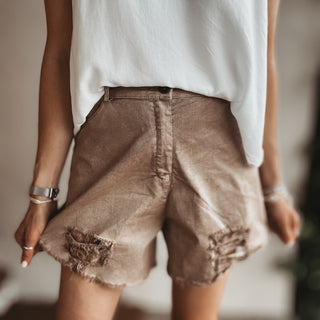 Distressed tan shorts