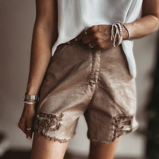 Distressed tan shorts
