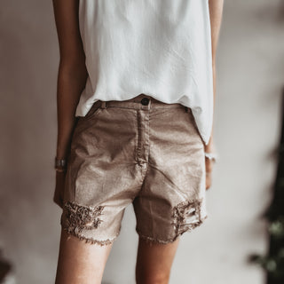 Distressed tan shorts