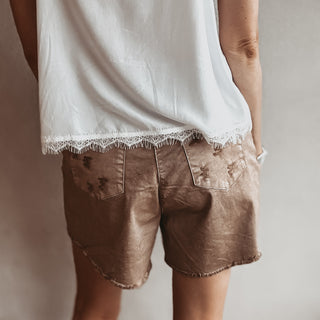 Distressed tan shorts