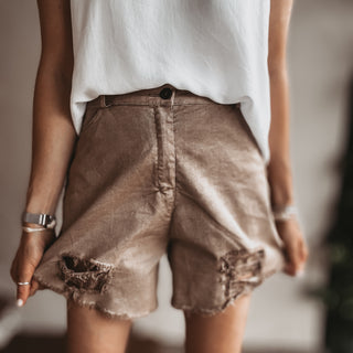 Distressed tan shorts