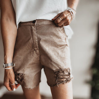 Distressed tan shorts