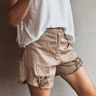 Distressed tan shorts