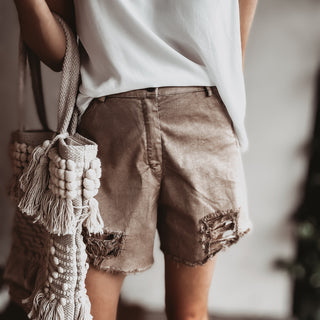Distressed tan shorts