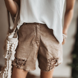 Distressed tan shorts