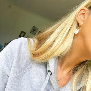 Cowrie shells on gold hoop earrings