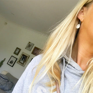 Cowrie shells on gold hoop earrings