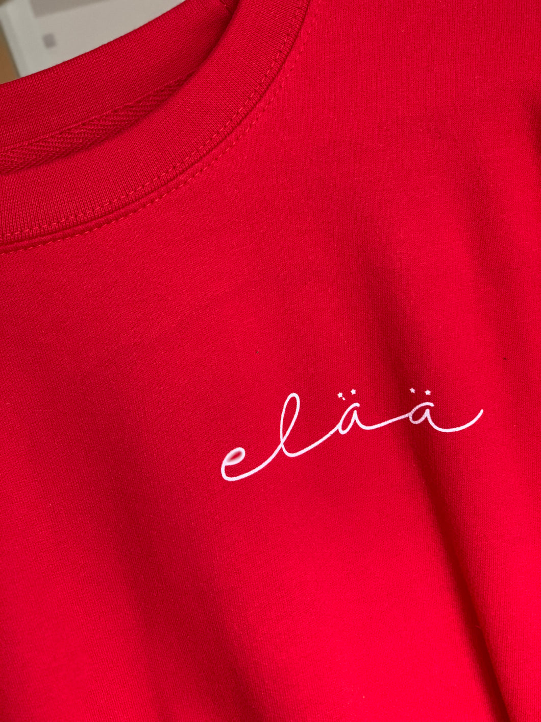 Red sweatshirt with white elaa (m, uk 12-14)