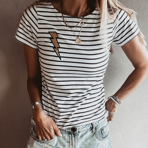 Gold lighting on light Breton striped tee