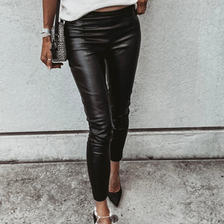 Assos black faux leather skinny pants