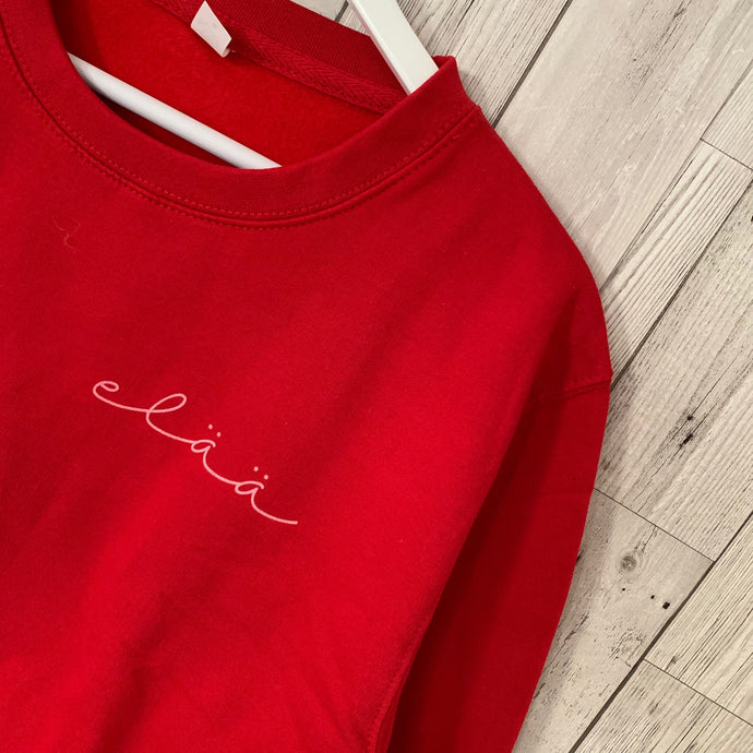 Red sweatshirt with pink elaa (m, uk 12-14)