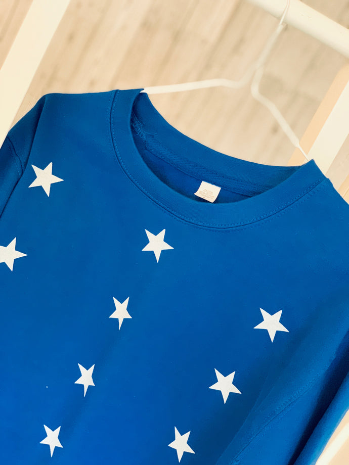 Little white stars on bright blue sweatshirt (medium size 12-14)