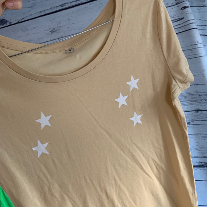 White scattered stars on a biscuit tee (medium