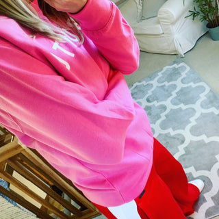 White UBUNTU on bright pink sweatshirt