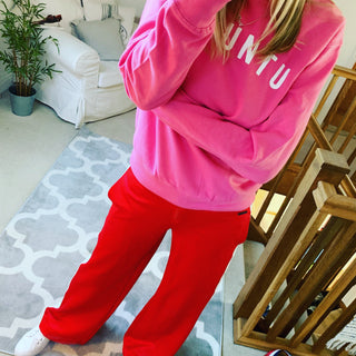 White UBUNTU on bright pink sweatshirt