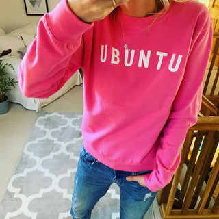 White UBUNTU on bright pink sweatshirt