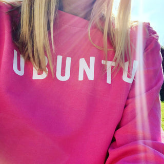 White UBUNTU on bright pink sweatshirt