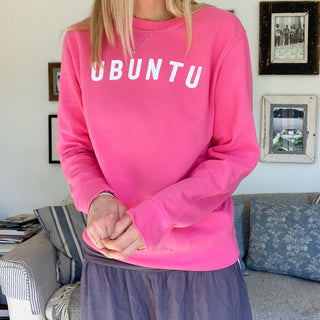 White UBUNTU on bright pink sweatshirt