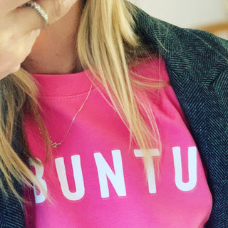 White UBUNTU on bright pink sweatshirt