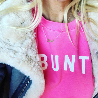 White UBUNTU on bright pink sweatshirt