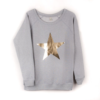 Metallic gold star on a light grey sweatshirt