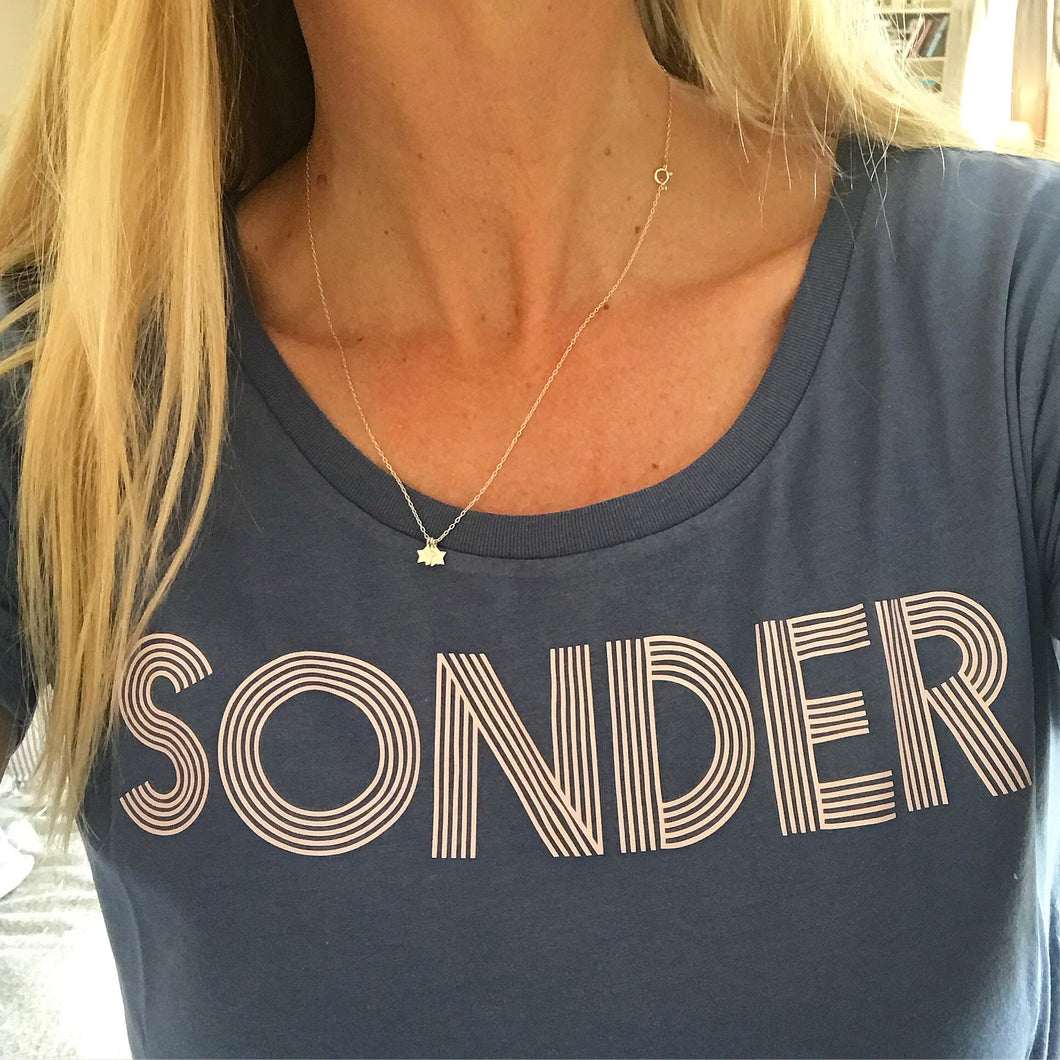 Pink SONDER on denim blue tee
