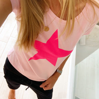 Neon pink star on pink tee