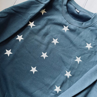 Little white stars on dark blue sweatshirt (size medium, UK 12-14)