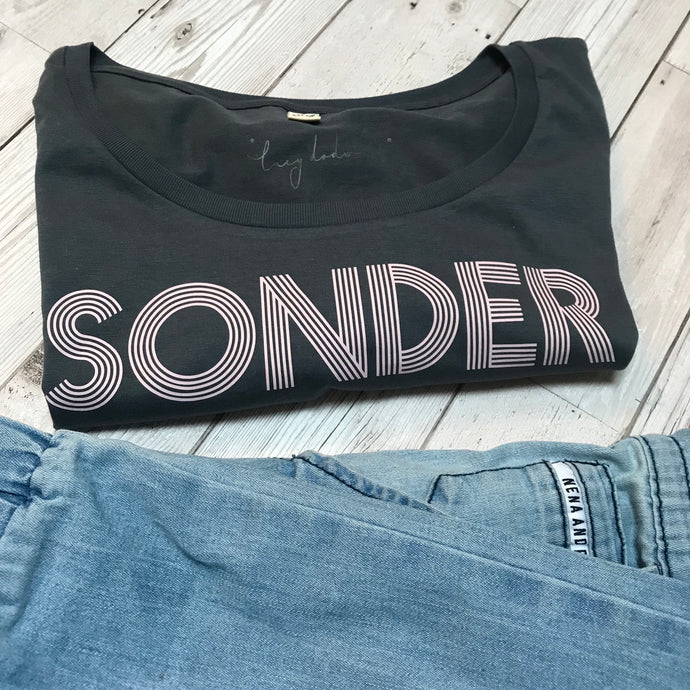 Pink SONDER on charcoal blue tee
