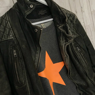 Neon orange star on dark grey sweat