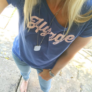 Pink hygge on denim blue tee *pre-loved*