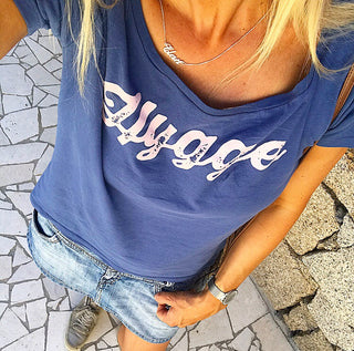 Pink hygge on denim blue tee *pre-loved*