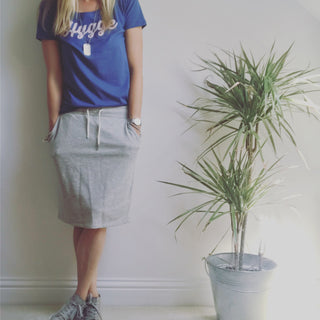 Pink hygge on denim blue tee *pre-loved*