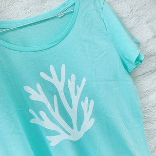 White coral on mint green tee