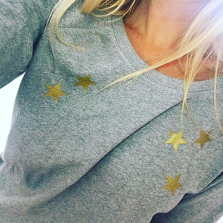Gold scattered stars on a grey sweat