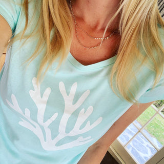 White coral on mint green tee