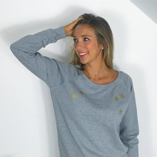 Gold scattered stars on a grey sweat