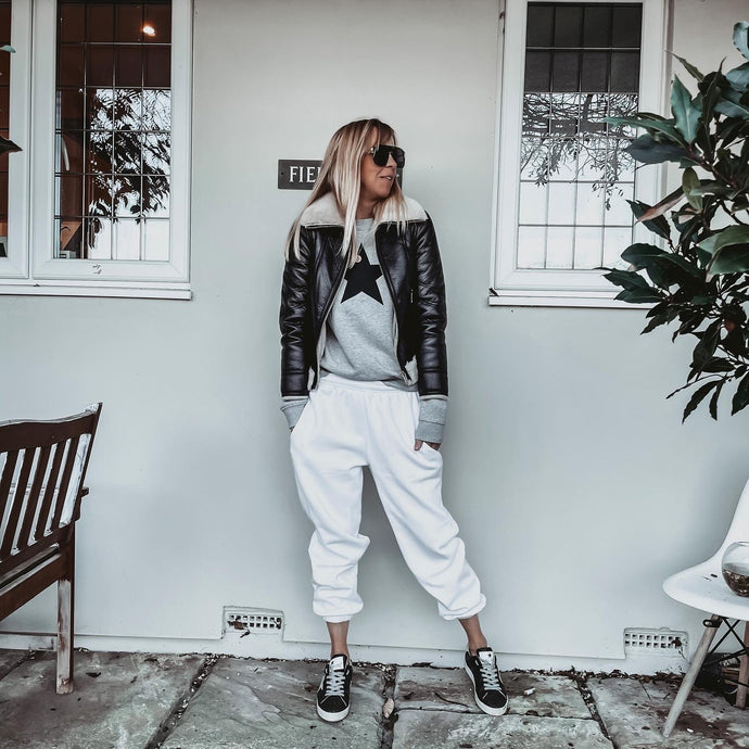 Black star on grey sweatshirt – Lucy Dodwell