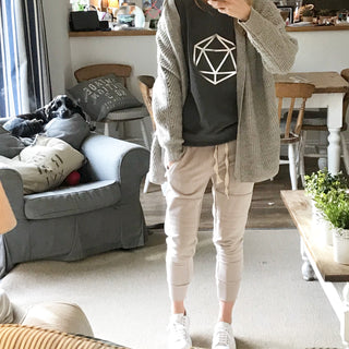 Metallic silver octahedron on a dark grey sweat