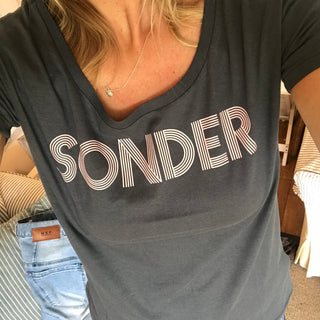 Pink SONDER on charcoal blue tee