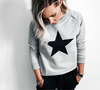 Black star on grey sweatshirt