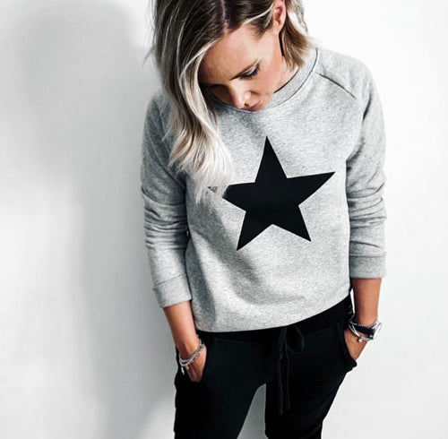 Black star on grey sweatshirt