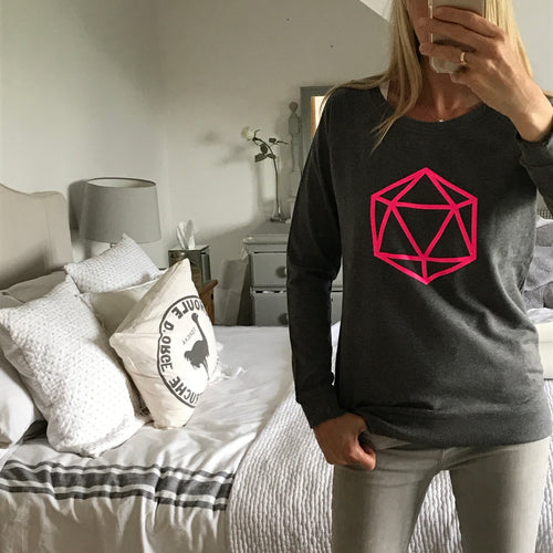 Neon pink octahedron on a dark grey sweatshirt