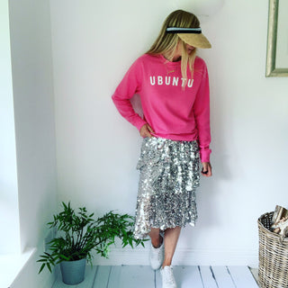 White UBUNTU on bright pink sweatshirt