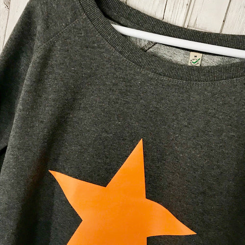 Neon orange star on dark grey sweat
