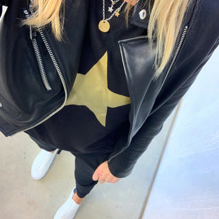 Gold star on a black sweatshirt *not many left now*