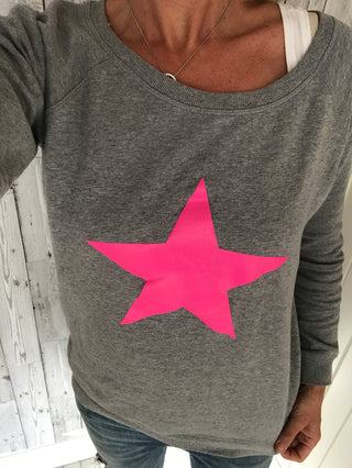 Neon pink star on light grey sweat