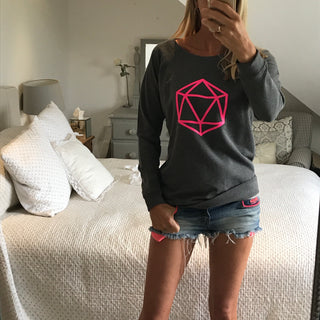Neon pink octahedron on a dark grey sweatshirt