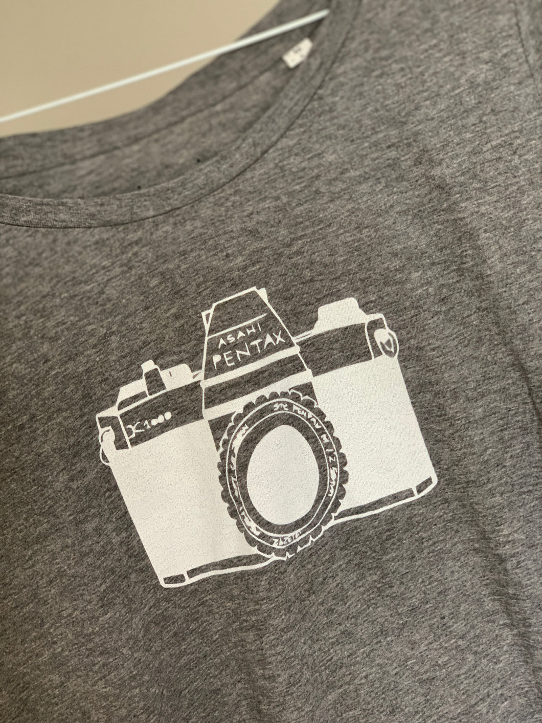 Camera on light grey tee (size 12)