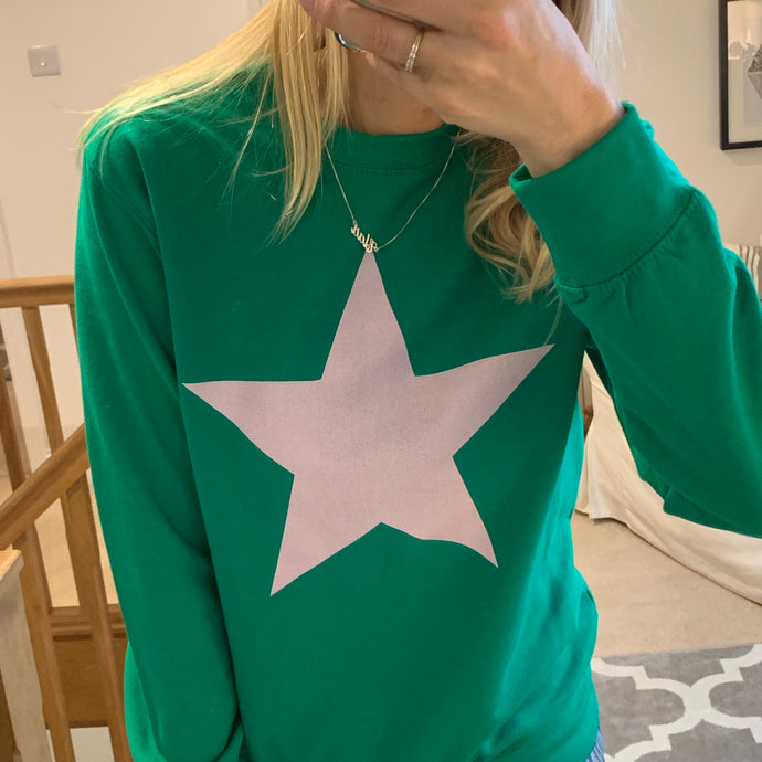 Pink star on green sweatshirt (size uk 12-14)